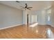 Spacious living room featuring hardwood floors and a ceiling fan at 445 Wright Way, Henderson, NV 89015