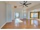 Bright and airy living room with hardwood floors and ceiling fan at 445 Wright Way, Henderson, NV 89015