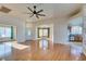 Spacious living room with hardwood floors and ceiling fan at 445 Wright Way, Henderson, NV 89015