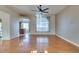 Open living room with hardwood floors and a view of the kitchen at 445 Wright Way, Henderson, NV 89015