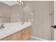 Bathroom with double sinks and a large mirror at 6192 Rocky Top Ave, Las Vegas, NV 89110