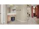 Bathroom featuring a vanity, makeup table, and tile flooring at 6192 Rocky Top Ave, Las Vegas, NV 89110