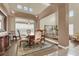 Formal dining room with chandelier and view into the living room at 6192 Rocky Top Ave, Las Vegas, NV 89110