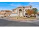 Two-story home with three-car garage, set on a corner lot with mature tree at 6192 Rocky Top Ave, Las Vegas, NV 89110