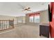 Upstairs loft featuring a ceiling fan, windows, and carpet at 6192 Rocky Top Ave, Las Vegas, NV 89110