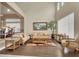 Bright living room featuring elegant furniture, high ceilings, and wood floors at 6192 Rocky Top Ave, Las Vegas, NV 89110