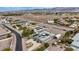 An aerial view showing the property's layout with large grounds, a rooftop pool, and views of the surrounding area at 647 Foxhall Rd, Henderson, NV 89002