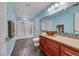 Bathroom featuring blue walls, granite counters, glass bowl sink, and shower with glass door at 647 Foxhall Rd, Henderson, NV 89002