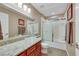 Bathroom showcasing a vanity with a glass bowl sink and a shower/tub combination at 647 Foxhall Rd, Henderson, NV 89002