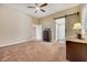 Spacious bedroom with sliding barn door access, ceiling fan, and neutral decor at 647 Foxhall Rd, Henderson, NV 89002