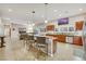 Open-concept kitchen with island, stainless steel appliances, and natural lighting at 647 Foxhall Rd, Henderson, NV 89002