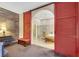 Main bathroom featuring double barn doors, a soaking tub, and a step-in shower at 647 Foxhall Rd, Henderson, NV 89002