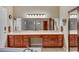 Main bathroom with dual sink vanity, decorative tile, and ample storage at 647 Foxhall Rd, Henderson, NV 89002