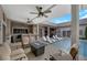 Relaxing outdoor seating area with a fire pit table overlooking a pristine pool and outdoor kitchen at 647 Foxhall Rd, Henderson, NV 89002