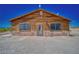 Log home exterior with stone accents at 561 Miranda Rd, Pahrump, NV 89060