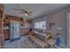 Rustic kitchen with wooden cabinets, stainless steel appliances, and a farmhouse table at 561 Miranda Rd, Pahrump, NV 89060