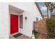 Red front door entrance with gated pathway at 6724 Reggie Cir, Las Vegas, NV 89107