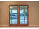 View of the backyard pool through double patio doors at 1052 Hollyhock Dr, Henderson, NV 89011