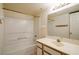 This bathroom features a bathtub, shower and vanity with a large mirror at 3550 Bay Sands Dr # 2044, Laughlin, NV 89029