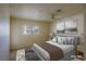 This bedroom features a ceiling fan, soft carpet, and large art pieces at 3550 Bay Sands Dr # 2044, Laughlin, NV 89029