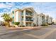 Attractive apartment building with balconies, colorful landscaping, and ample parking at 3550 Bay Sands Dr # 2044, Laughlin, NV 89029