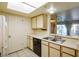This cute kitchen has a double sink, tile flooring, and bright cabinets at 3550 Bay Sands Dr # 2044, Laughlin, NV 89029