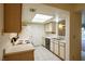 This quaint kitchen features tile flooring, bright cabinets, and modern appliances at 3550 Bay Sands Dr # 2044, Laughlin, NV 89029