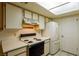 This quaint kitchen features tile flooring, bright cabinets and a double door fridge at 3550 Bay Sands Dr # 2044, Laughlin, NV 89029