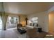 This lovely living room features a sofa, chairs, and a large glass door at 3550 Bay Sands Dr # 2044, Laughlin, NV 89029
