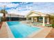 Inviting community pool with lounge chairs, a covered area, and a jacuzzi for relaxation at 3550 Bay Sands Dr # 2044, Laughlin, NV 89029