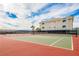 Well-maintained tennis court with a view of the building and clear blue skies in the background at 3550 Bay Sands Dr # 2044, Laughlin, NV 89029