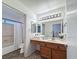 Functional bathroom featuring a vanity with sink, a large mirror, and clean lines, offering a serene and practical space at 2800 Linkview Dr, Las Vegas, NV 89134