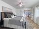 Bedroom with tiled floor and ceiling fan overlooking a seating area with French doors at 2800 Linkview Dr, Las Vegas, NV 89134