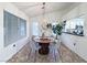 Charming dining area with a contemporary chandelier, round table, and view of the kitchen at 2800 Linkview Dr, Las Vegas, NV 89134