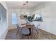 Inviting dining area with a chandelier, a round table, and a view of the kitchen at 2800 Linkview Dr, Las Vegas, NV 89134