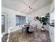 Dining area featuring a modern chandelier, a round table, and stylish decor creating an inviting atmosphere at 2800 Linkview Dr, Las Vegas, NV 89134