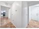 Hallway leading to the kitchen with tile flooring and bright white walls at 2800 Linkview Dr, Las Vegas, NV 89134