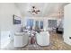 Bright living room with vaulted ceilings and neutral color palette, and a view of the dining area at 2800 Linkview Dr, Las Vegas, NV 89134