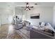 Open living room with vaulted ceilings, ceiling fan, and neutral color scheme, leading to the bedroom at 2800 Linkview Dr, Las Vegas, NV 89134