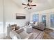 Living room with vaulted ceilings, neutral decor, and French doors to the backyard at 2800 Linkview Dr, Las Vegas, NV 89134