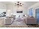 Cozy living room with vaulted ceilings, ceiling fan, neutral color palette, and lots of natural light at 2800 Linkview Dr, Las Vegas, NV 89134