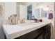 Bathroom vanity featuring quartz countertops, a modern faucet, and ample storage space at 410 Giocoso Ct, Henderson, NV 89011