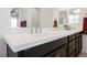 Bathroom detail with white quartz countertop, black cabinetry and brushed nickel faucets at 410 Giocoso Ct, Henderson, NV 89011