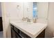 Modern half bathroom with a white countertop, decorative accents, and ample lighting at 410 Giocoso Ct, Henderson, NV 89011