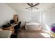 Cozy bedroom with a ceiling fan, a neutral color palette, and a large window for natural light at 410 Giocoso Ct, Henderson, NV 89011