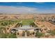 Community center with a refreshing pool surrounded by a desert landscape in this aerial view at 410 Giocoso Ct, Henderson, NV 89011