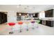 Stylish kitchen island with granite countertop, stainless steel appliances and modern lighting at 410 Giocoso Ct, Henderson, NV 89011