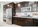 Close up on a kitchen with granite countertop and stainless steel appliances at 410 Giocoso Ct, Henderson, NV 89011