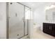 Sleek main bathroom featuring a glass shower, soaking tub, and modern vanity at 410 Giocoso Ct, Henderson, NV 89011