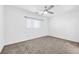 Bright bedroom with ceiling fan and carpet flooring at 5266 Sherwood Forest Ln, Las Vegas, NV 89122